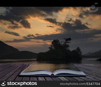 Stunning mountain and lake sunrise reflections beautiful landscape with sunbeams. Creative concept pages of book Beautiful sunrise reflected in calm Cregennen Lakes in Snowdonia National Park landscape with sunbeams