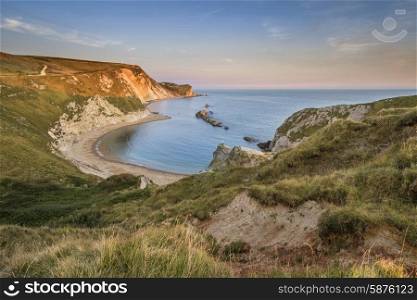 Stunning natural cove coastal landscape at sunset with beautiful sky
