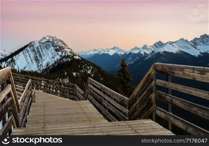Stunning rocky mountains twilight scene of boardwalk on Sulphur Mountain connect to Gondola landing in Banff, Canada. Gondola ride to Sulphur Moutain overlooks the Bow Valley and the town of Banff.