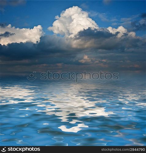 Stunning sky reflected in calm sea waters