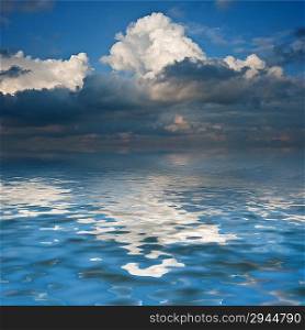 Stunning sky reflected in calm sea waters