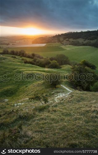 Stunning Spring sunrise over English countryside landscape escarpment