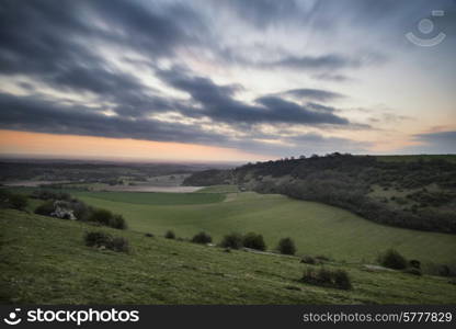 Stunning Spring sunrise over English countryside landscape escarpment