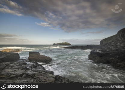 Stunning sunrise landscape of Godrevy lighthouse on Cornwall coastline in England