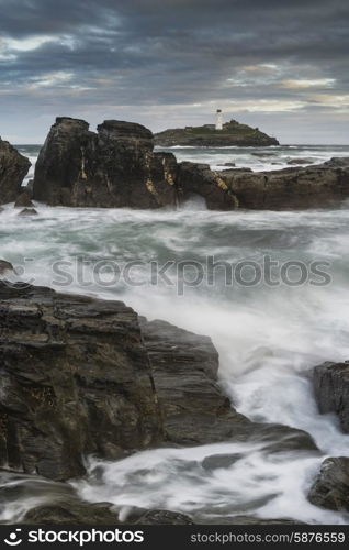 Stunning sunrise landscape of Godrevy lighthouse on Cornwall coastline in England