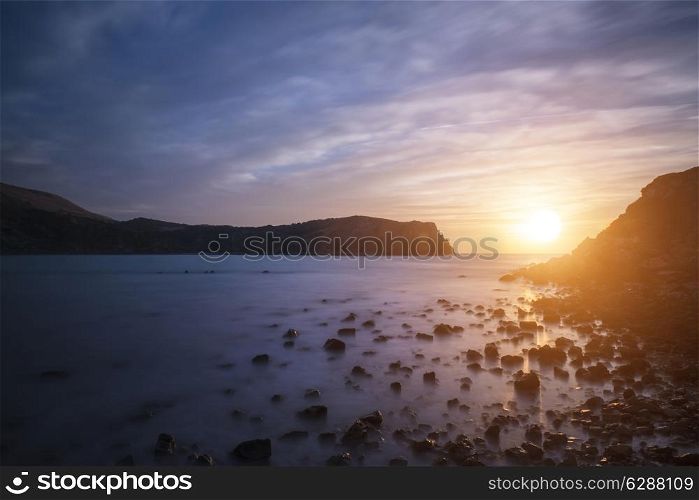 Stunning sunrise landscape over Lulworth Cove Jurassic Coast England