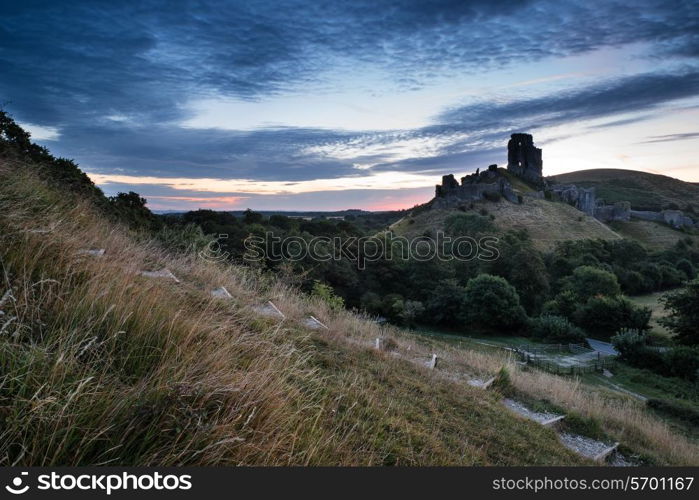 Stunning sunrise landscape over ruins of medieval castle