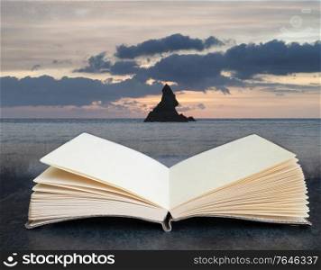 Stunning sunrise landsdcape of idyllic Broadhaven Bay beach on Pembrokeshire Coast in Wales coming out of pages in a book