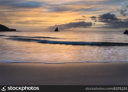 Stunning sunrise landsdcape of idyllic Broadhaven Bay beach on Pembrokeshire Coast in Wales
