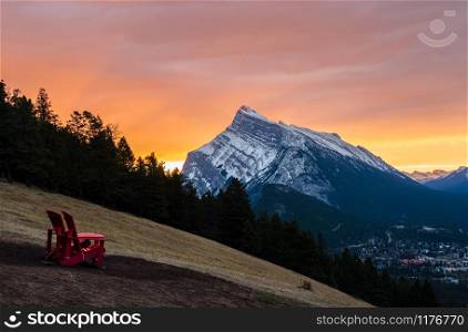 Stunning sunrise scenery of Mount Rundle and Banff town in Banff National Park in Alberta, Canada. Seen from a vantage point on the road to Mount Norquay.