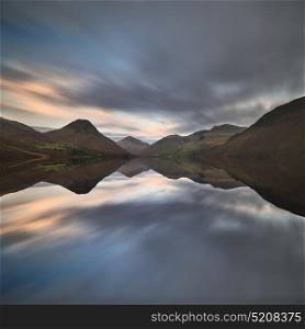 Stunning sunset landscape image of Wast Water and mountains in Lkae District in Autumn in England