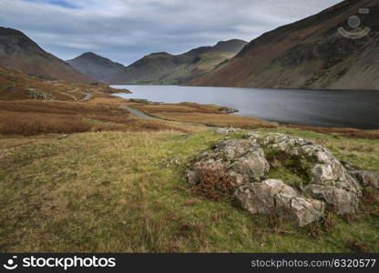 Stunning sunset landscape image of Wast Water and mountains in Lkae District in Autumn in England