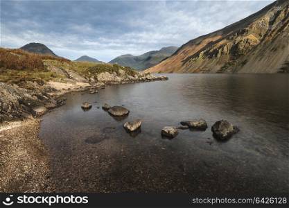 Stunning sunset landscape image of Wast Water and mountains in Lkae District in Autumn in England