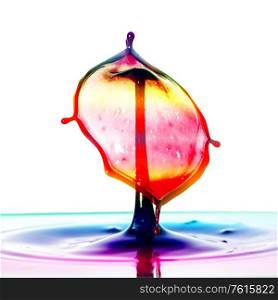 Stunning unique abstract water splash photography images with vibrant colorful water collisions captured using high speed flash technique