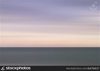 Stunning vibrant conceptual image of peaceful sea at sunset. Beautiful vibrant conceptual image of peaceful sea at sunset