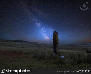 Stunning vibrant Milky Way composite image over landscape of Ancient prehistoric stones in Wales