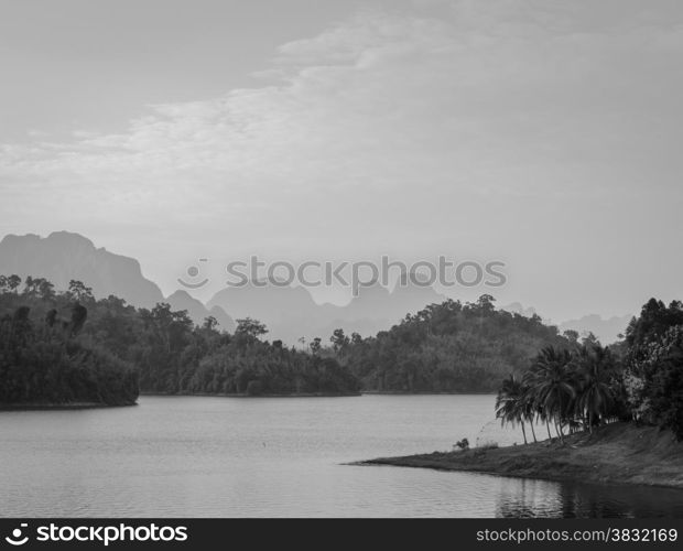 Stunning view of Limestone mountains and lake in Khao Sok National Park, Surat Thani Province, Thailand. Black and white color.