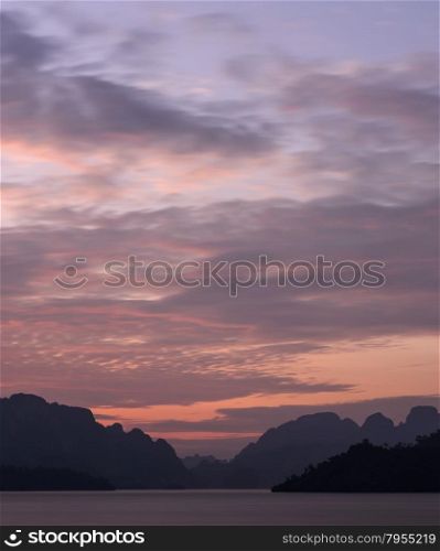 Stunning view of Limestone mountains and lake in Khao Sok National Park, Surat Thani Province, Thailand. Long exposure shot.