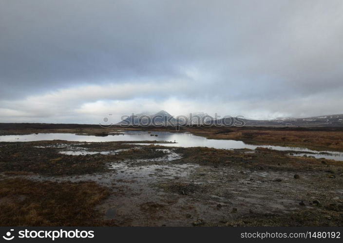 Stunning view of snow capped mountains on a foggy day