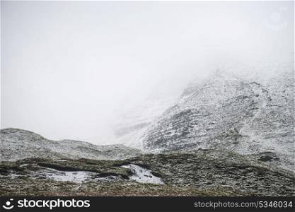 Stunning Winter landscape image around Mam Tor countryside in Peak District England