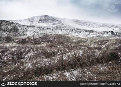 Stunning Winter landscape image around Mam Tor countryside in Peak District England