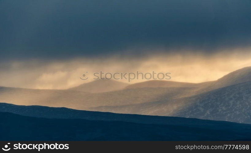 Stunning Winter landscape image of view along Rannoch Moor during heavy rainfall giving misty look to the scene