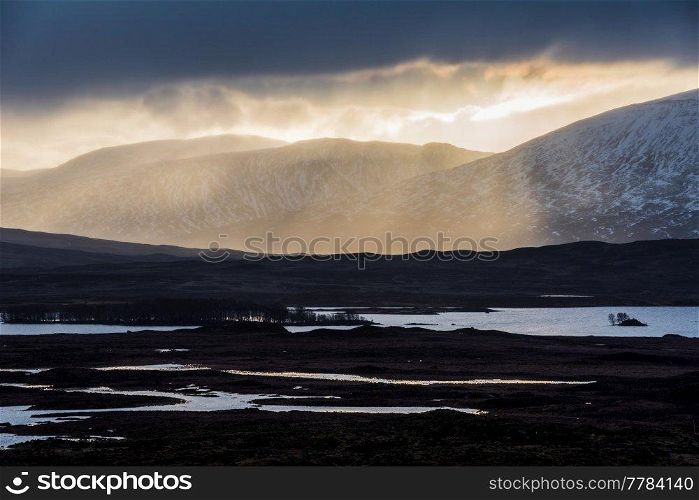 Stunning Winter landscape image of view along Rannoch Moor during heavy rainfall giving misty look to the scene
