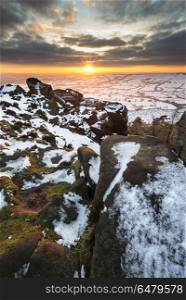 Stunning Winter sunset over snow covered Winter landscape in Pea. Landscapes. Winter sky over snow covered Winter landscape in Peak District at sunset