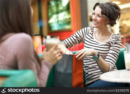 Stunning women after shopping talking with friend