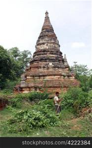 Stupa and man in Inwa, Mandalay, Myanmar