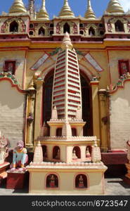 Stupa near the wall of temple in Mohnyin Thambuddhei Paya, Moniwa, Myanmar