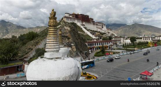Stupa with Potala Palace in the background, Lhasa, Tibet, China