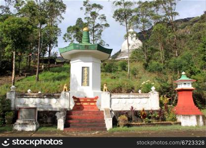Stupas and staircase under Adam&rsquo;s Peak in Sri Lanka