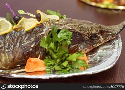 sturgeon . sturgeon baked with greens fruits and vegetables