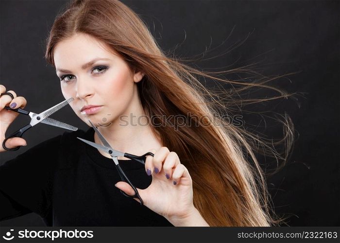 Style and fashion. Professional hairstylist barber with new idea of look changing. Long haired woman with scissors creating hairdo coiffure.. Female hairstylist barber with scissors.