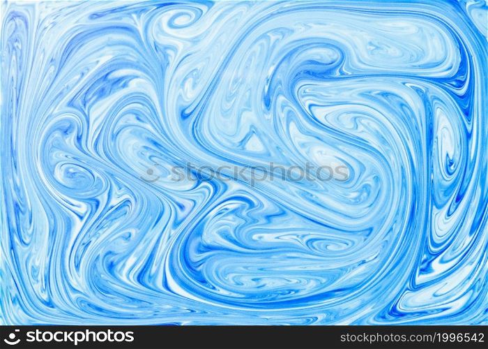style ebru painting with blue acrylic paint swirls