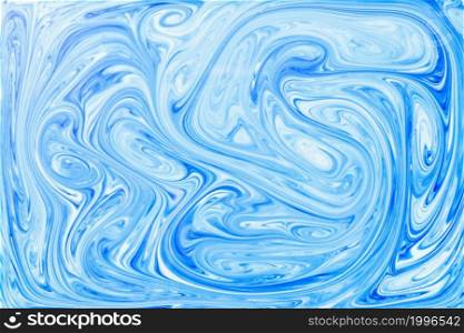 style ebru painting with blue acrylic paint swirls