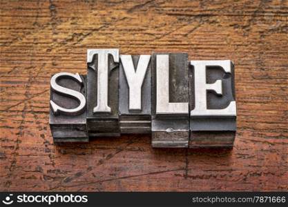 style word in mixed vintage metal type printing blocks over grunge wood