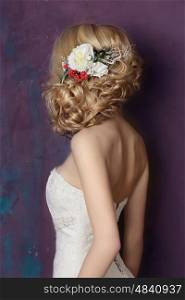 Styling hair with flowers. Portrait of the bride. Hairstyle.