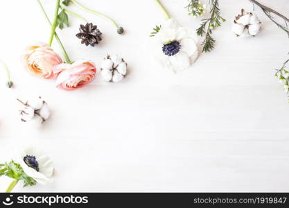 Stylish branding mockup to display your artworks. Cute vintage mock up on wooden background. Flat lay top view.. Cute and stylish branding mockup photo wit flowers.