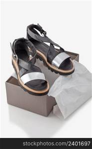 stylish, comfortable, women sandals on a box. white background