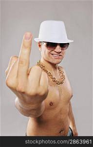 Stylish man in white hat showing middle finger