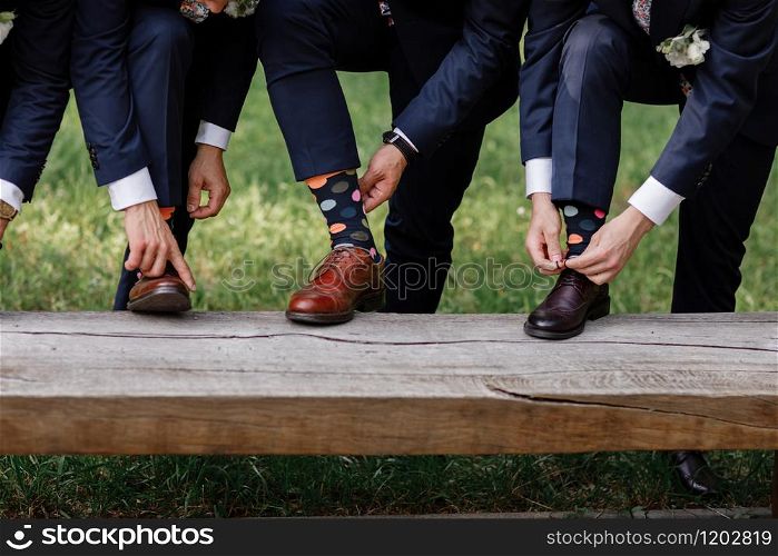 stylish men&rsquo;s socks. Stylish suitcase, men&rsquo;s legs, multicolored socks and new shoes. Concept of style, fashion, beauty and vacation.. stylish men&rsquo;s socks. Stylish suitcase, men&rsquo;s legs, multicolored socks and new shoes. Concept of style, fashion, beauty and vacation