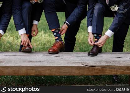 stylish men&rsquo;s socks. Stylish suitcase, men&rsquo;s legs, multicolored socks and new shoes. Concept of style, fashion, beauty and vacation.. stylish men&rsquo;s socks. Stylish suitcase, men&rsquo;s legs, multicolored socks and new shoes. Concept of style, fashion, beauty and vacation
