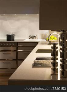 Stylish Modern Contemporary Kitchen with Underlighting and Silver Candle Sticks