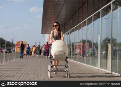 Stylish mom with retro stroller