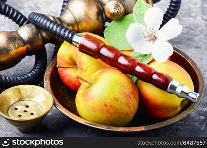 Stylish oriental shisha with apple. East hookah with the aroma apple for relax.Apple shisha.Shisha hookah