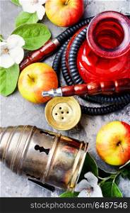 Stylish oriental shisha with apple. Oriental hookah with the aroma apple for relax.Apple shisha