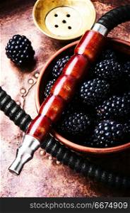 Stylish oriental shisha with blackberry. Oriental hookah with the aroma blackberry for relax.Blackberry shisha