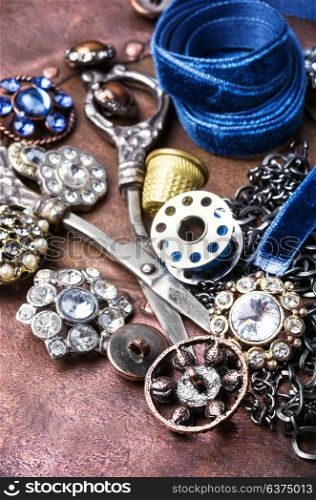Stylish sewing accessories. Fashionable brooches and buttons from clothing. Retro style